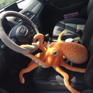 Vibrant Orange Plush Octopus with Green Eyes