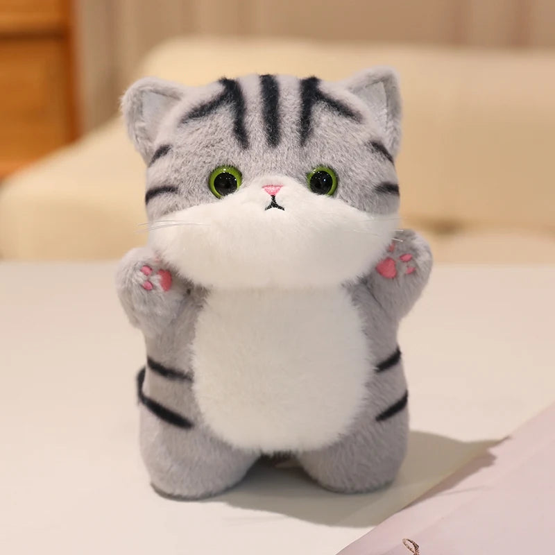 Adorable Plush Cat in Striped Cupcake Bed - Image 12