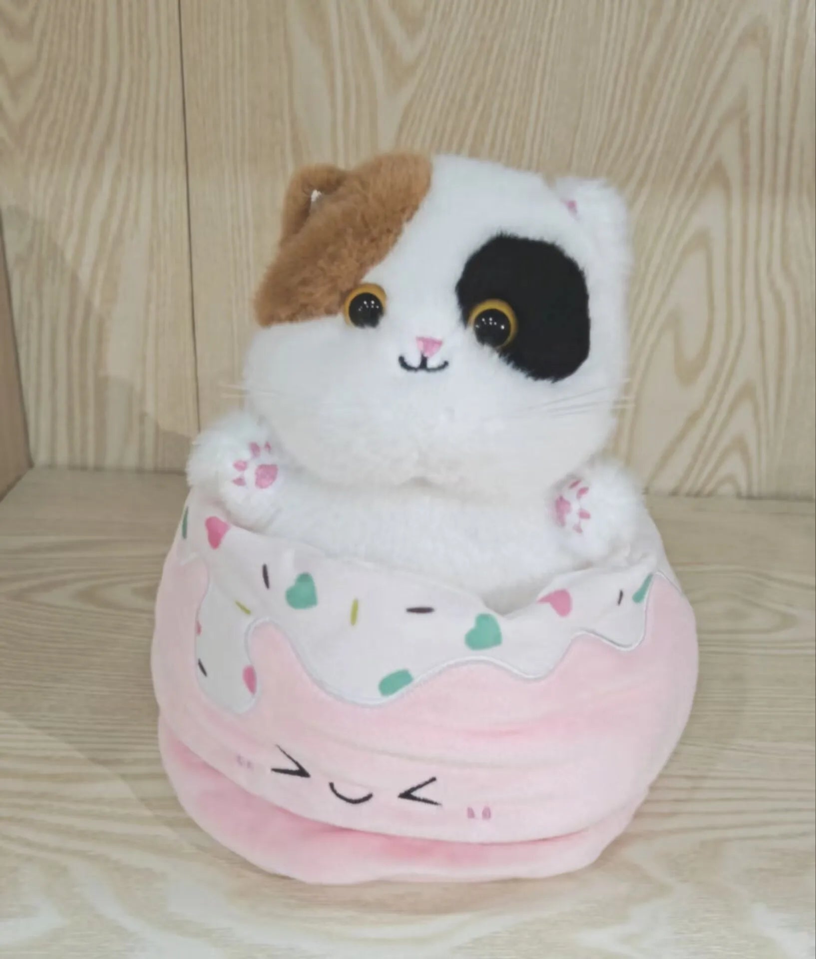 Adorable Plush Cat in Striped Cupcake Bed - Image 9