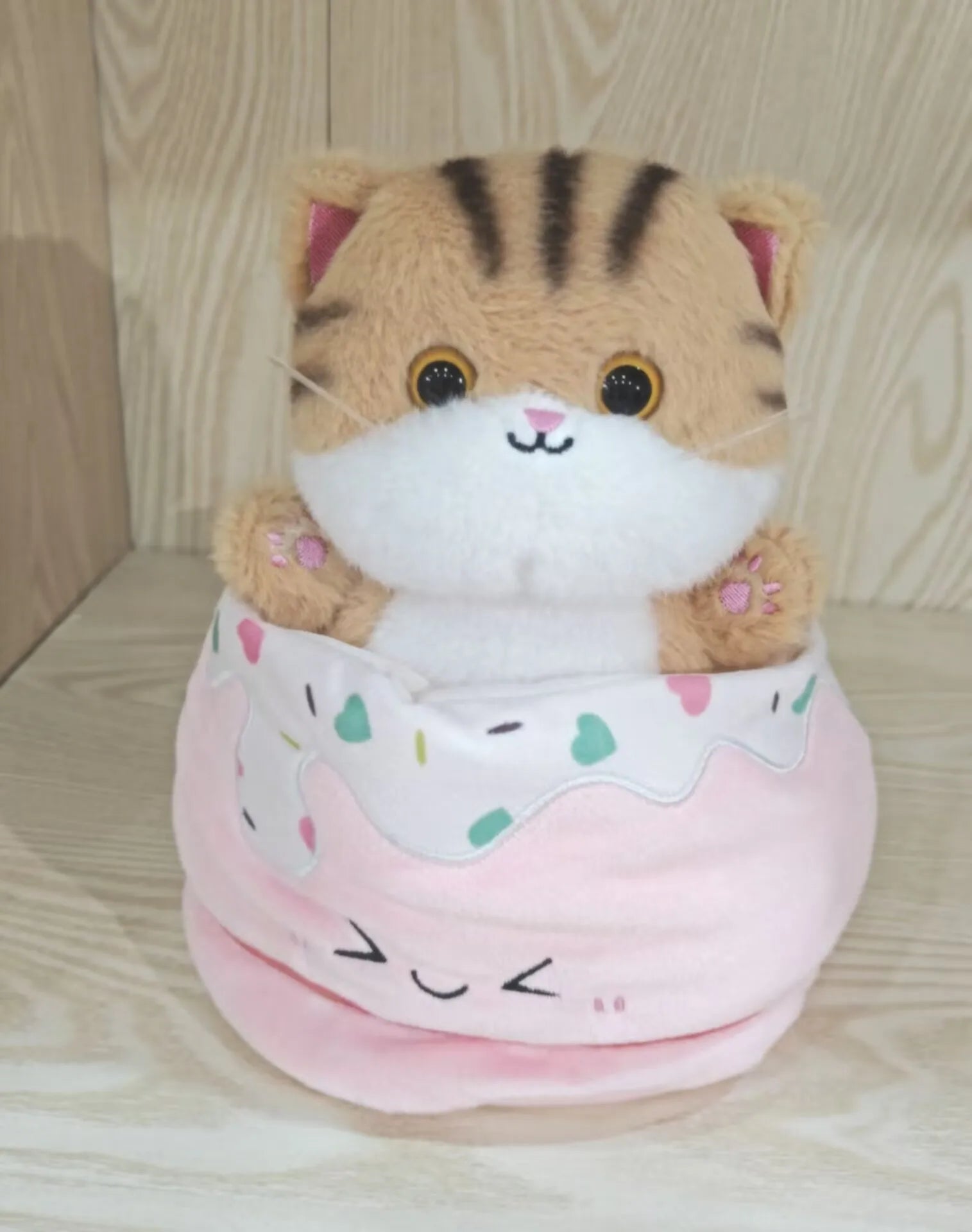 Adorable Plush Cat in Striped Cupcake Bed - Image 10