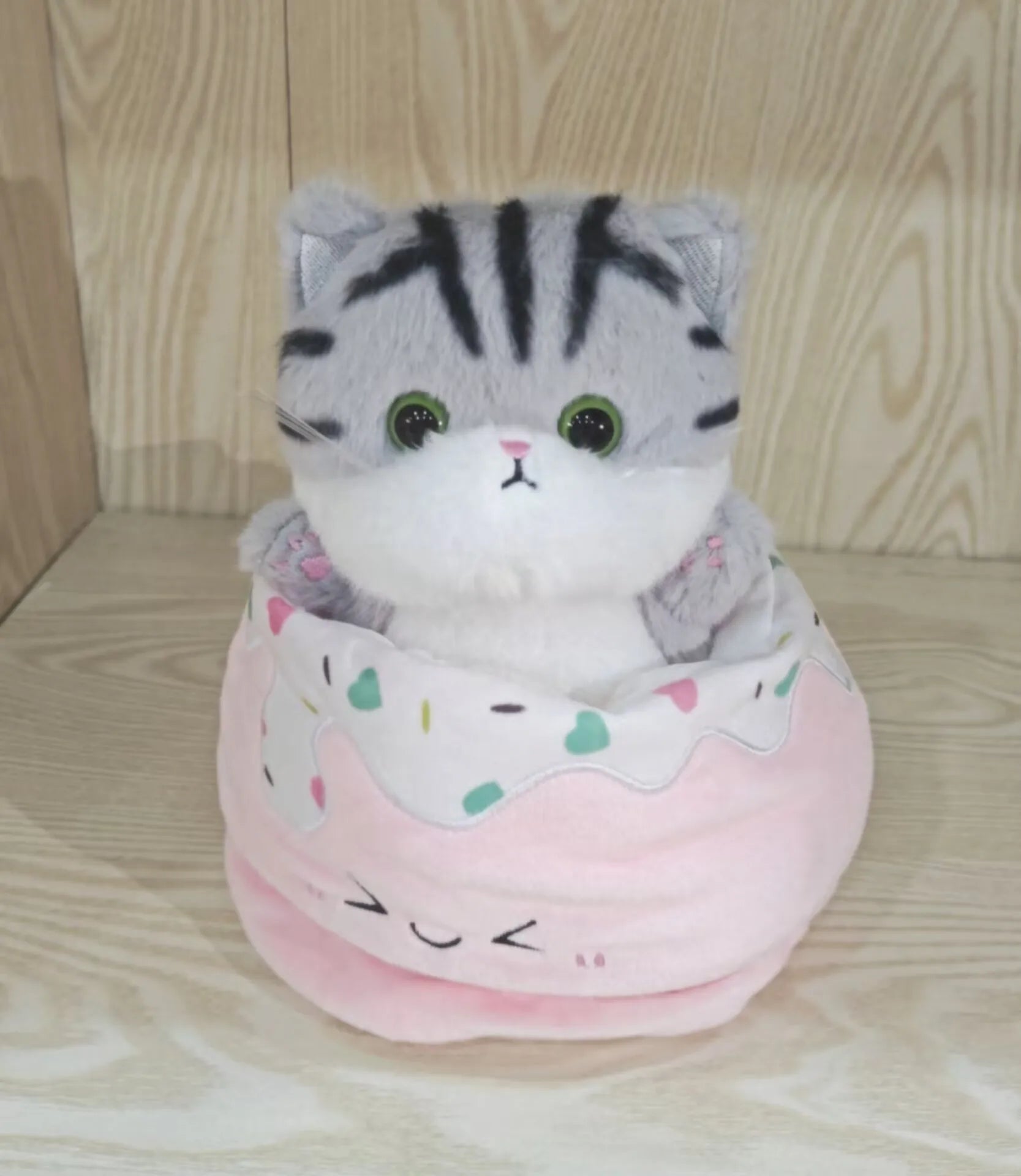 Adorable Plush Cat in Striped Cupcake Bed - Image 6