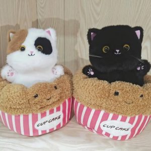 Adorable Plush Cat in Striped Cupcake Bed