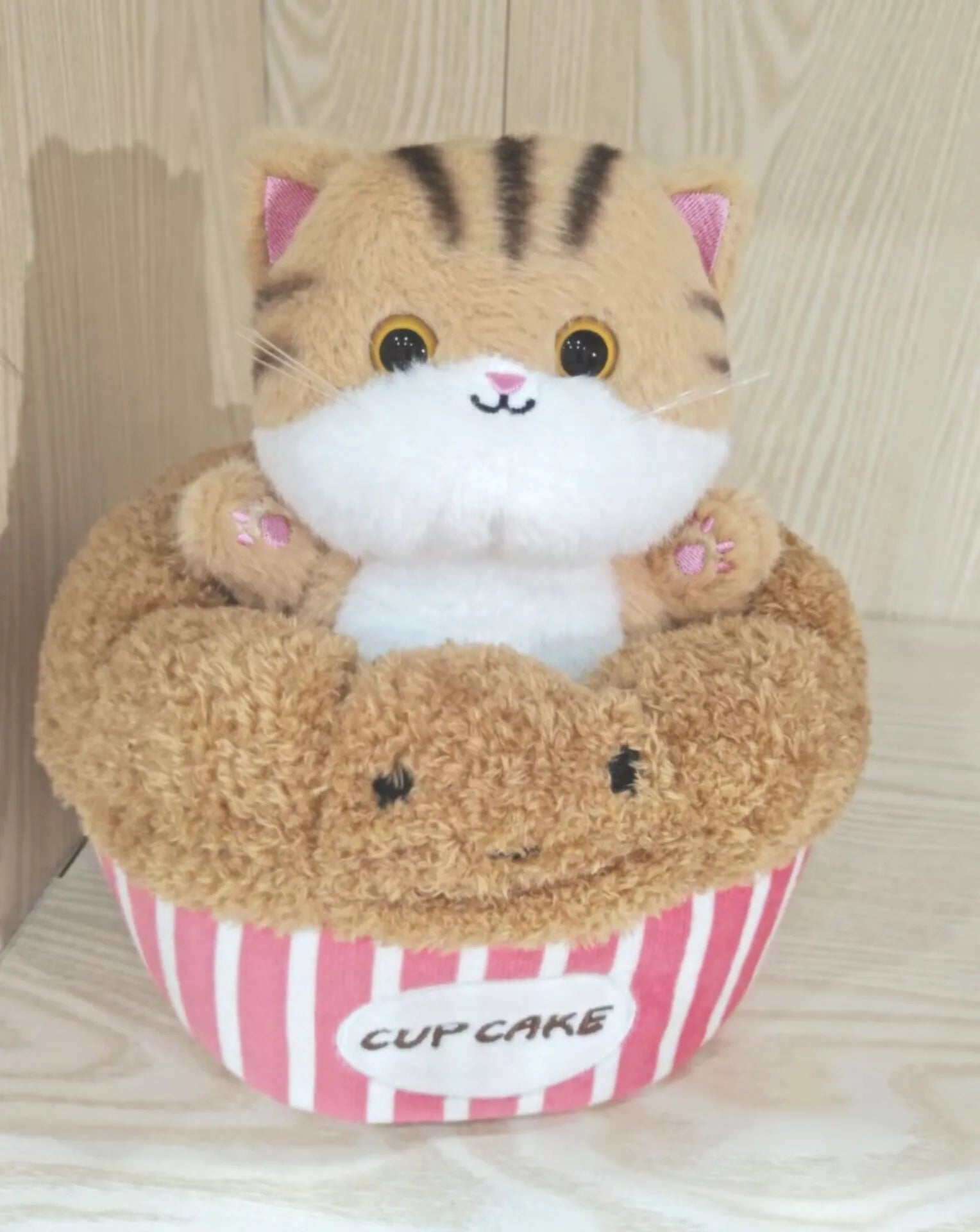 Adorable Plush Cat in Striped Cupcake Bed - Image 16